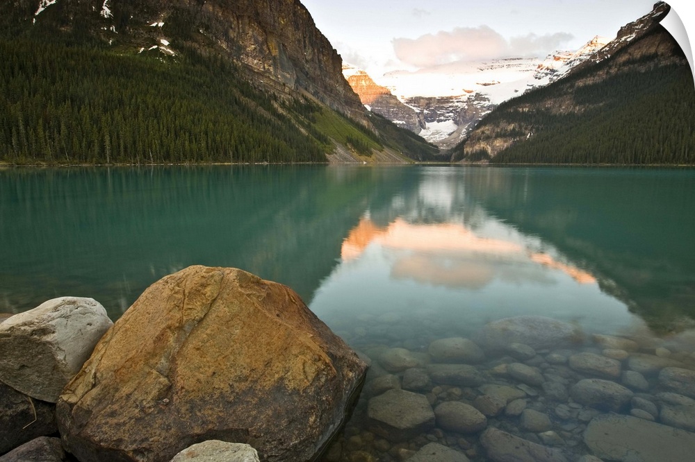 North America, Canada, Alberta, Banff National Park, Rocky Mountains and boulders reflected in Lake Louise, June