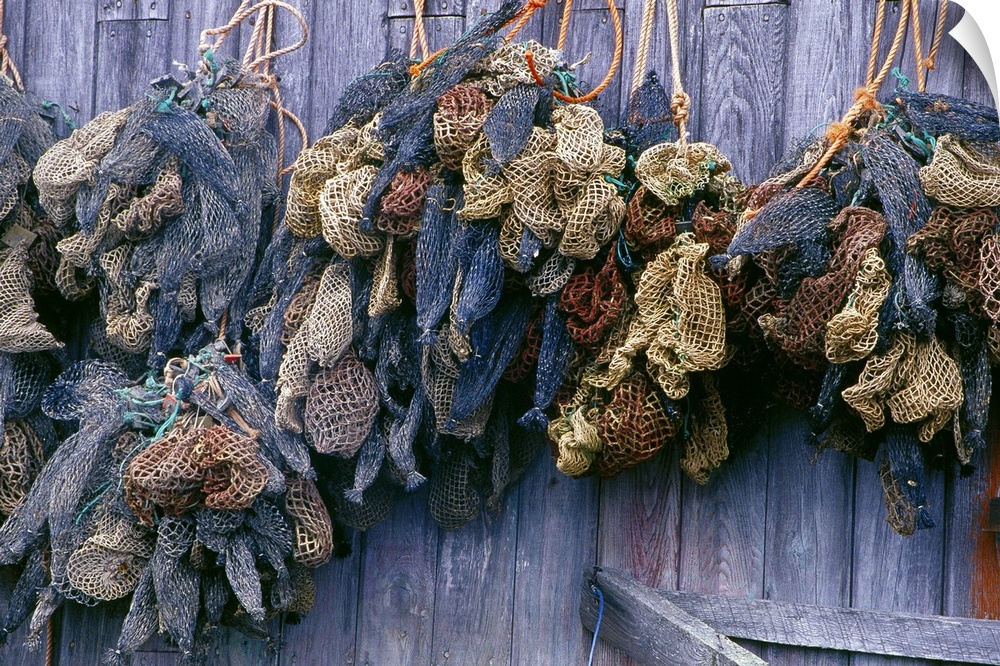 N.A. Canada, Nova Scotia, Hunts Point.  Bait bags on fish shed wall.