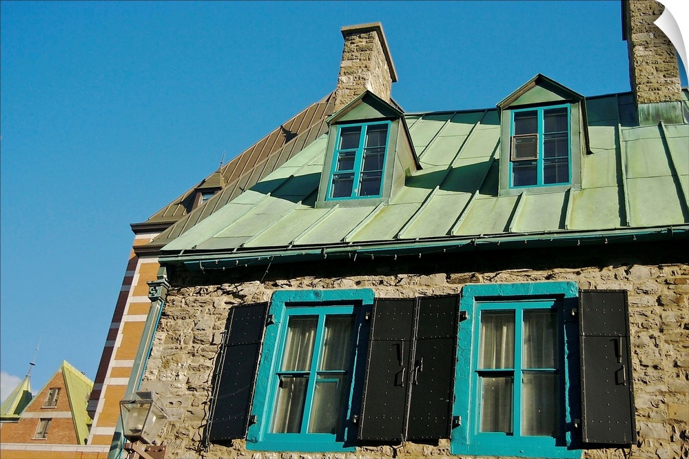North America, Canada, Quebec, Old Quebec City.  A stone home's upper windows and copper roof