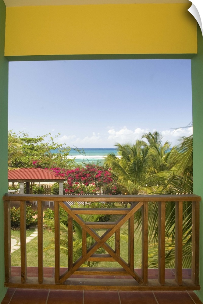 Caribbean, Puerto Rico, Vieques.  Caribbean, beach and palm trees, viewed from porch of house/hotel.  PR