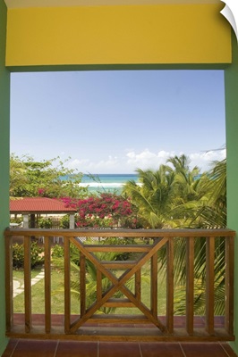 Caribbean, Puerto Rico, Vieques, beach and palm trees, viewed from porch