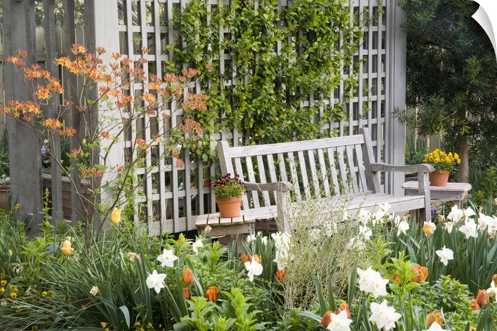 USA, Georgia, Pine Mountain. Chair in the patio area of a flower garden.