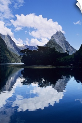 Cloud-capped Mitre Peak rises out of Milford Sound, South Island, New Zealand