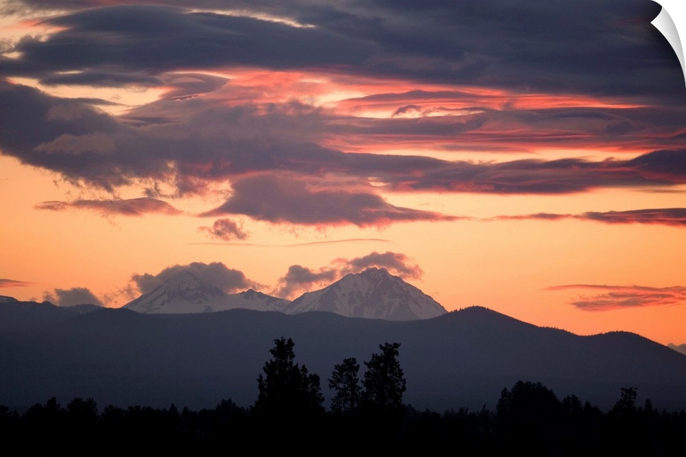 USA, Oregon, Bend. Clouds gather around the Soth and Middle Sisters at sunset in Deschutes County, Oregon.