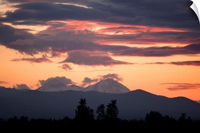 Clouds gather around the South and Middle Sisters at sunset, Bend, Oregon.