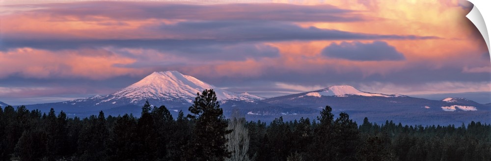 USA, Oregon, Mt Bachelor. Clouds take on sunrise colors above Mt Bachelor in the Cascades Range near Bend, Oregon.