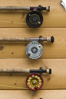 Fishing rods wait for customers on the wall of the lodge