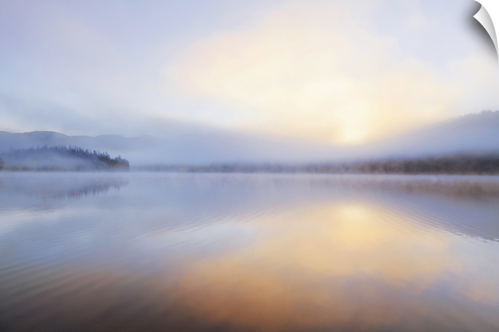 Foggy sunrise over Beaver Lake in the Stillwater State Forest near Whitefish, Montana, USA