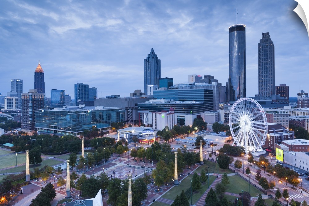 Georgia, Atlanta, Centennial Olympic Park, elevated city view with Ferris wheel, dusk.