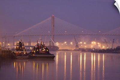 Georgia, Savannah, Tugboats and bridge at dawn along the Savannah River