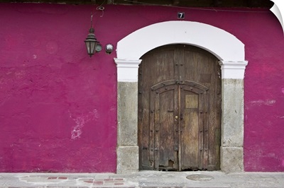 Guatemala, Antigua, ornate wooden doors of home in the town of Antigua