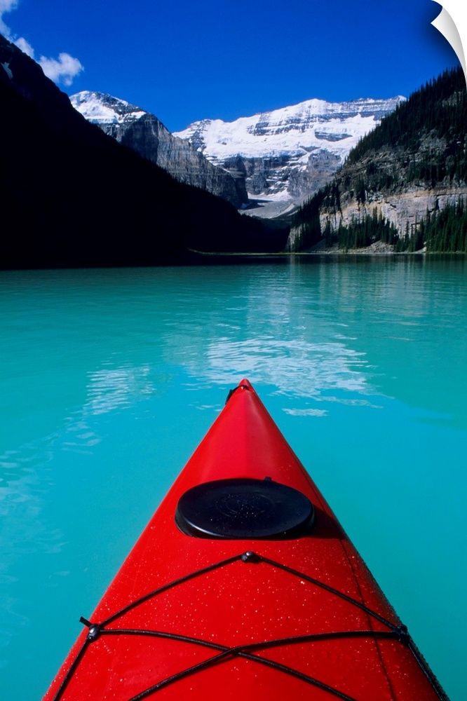 Kayak on Lake Louise below Mount Victoria in the Canadian Rockies; Banff National Park; Alberta, Canada