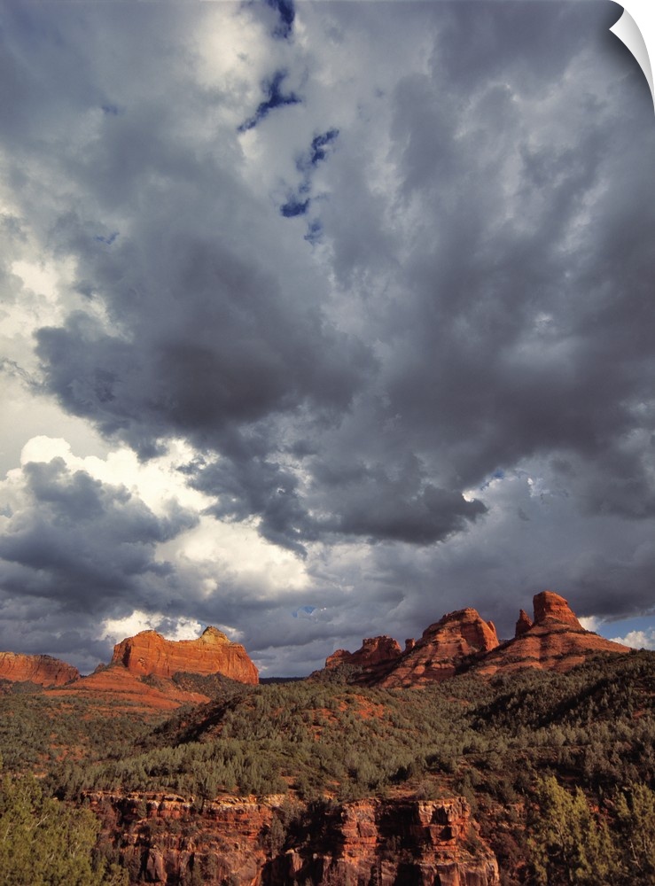USA, Arizona, Oak Creek Canyon. Menacing clouds race through the red rocks of Oak Creek Canyon in Arizona.