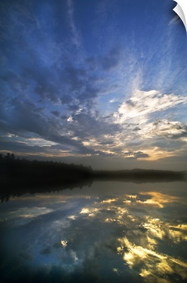 Michigan, Upper Peninsula. Sunrise sky reflected in Pete's Lake