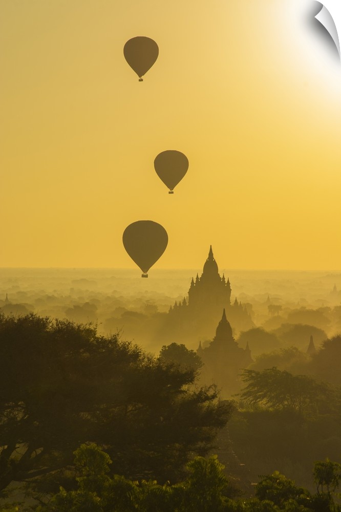 Myanmar. Bagan. Hot air balloons rising over the temples of Bagan.