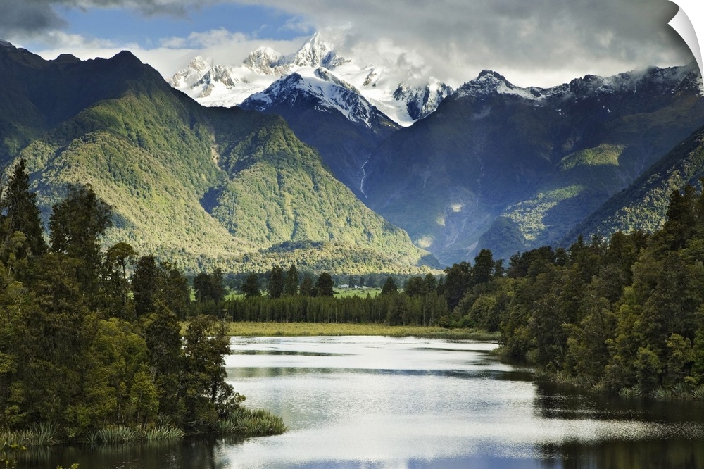 New Zealand, South Island. Cloud-shrouded Mt. Cook as seen from Lake Matheson near the town of Fox Glacier. Credit as: Den...