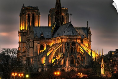 Notre Dame Cathedral And The Seine River Shimmer In The Paris, France, Night