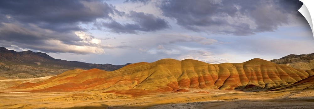 USA, Oregon, John Day Fossil Beds National Monument. Panoramic of the Painted Hills and storm clouds.