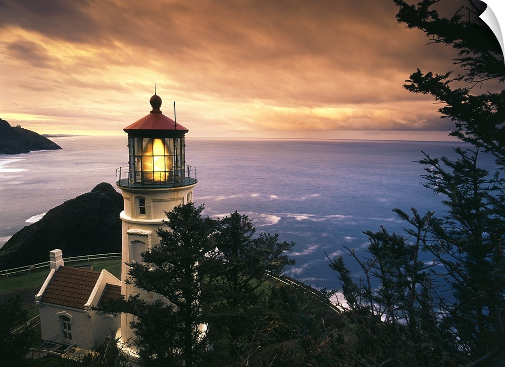 Oregon, View of Heceta Head Lighthouse at sunset.