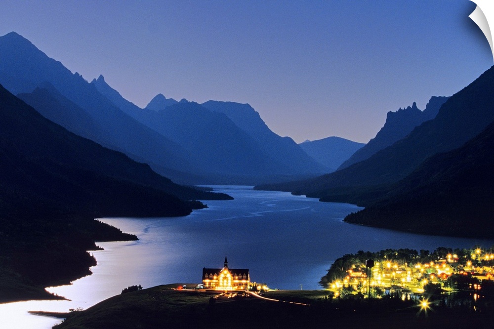 Prince of Wales Hotel and townsite in Waterton Lakes National Park in Alberta Canada under full moonlight