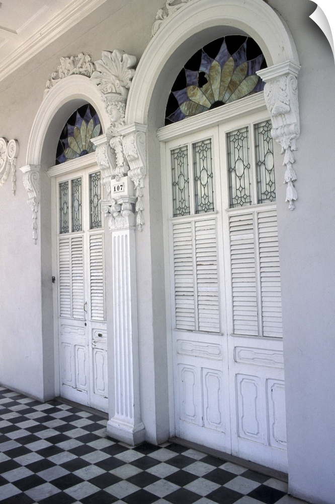 Puerto Rico, Ponce. Historic District and houses from 19th Century; doors with stucco decorations and black and white tile...