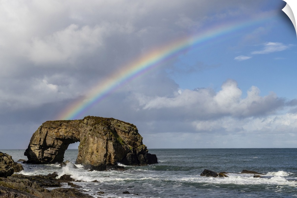 Rainbow over The Great Pollet Sea Arch in County Donegal, Ireland.
