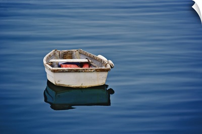 Single small boat floating on ocean, Maine