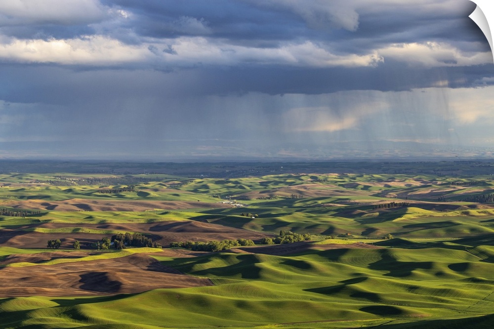 Stormy clouds over rolling hills from Steptoe Butte near Colfax, Washington State, USA.