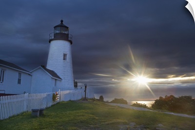 Sun breaks through the clouds at Pemaquid Point Lighthouse in New Harbor, Maine