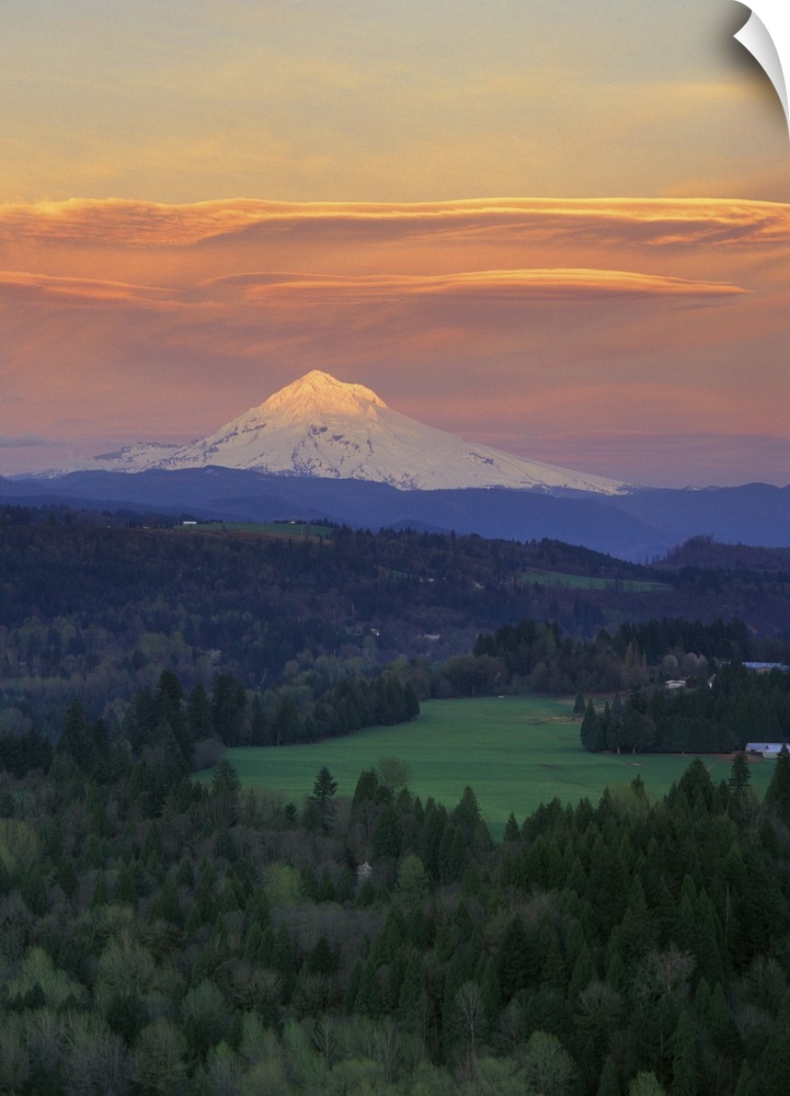 Sunset light colors clouds over Mt Hood, Oregon Cascades.