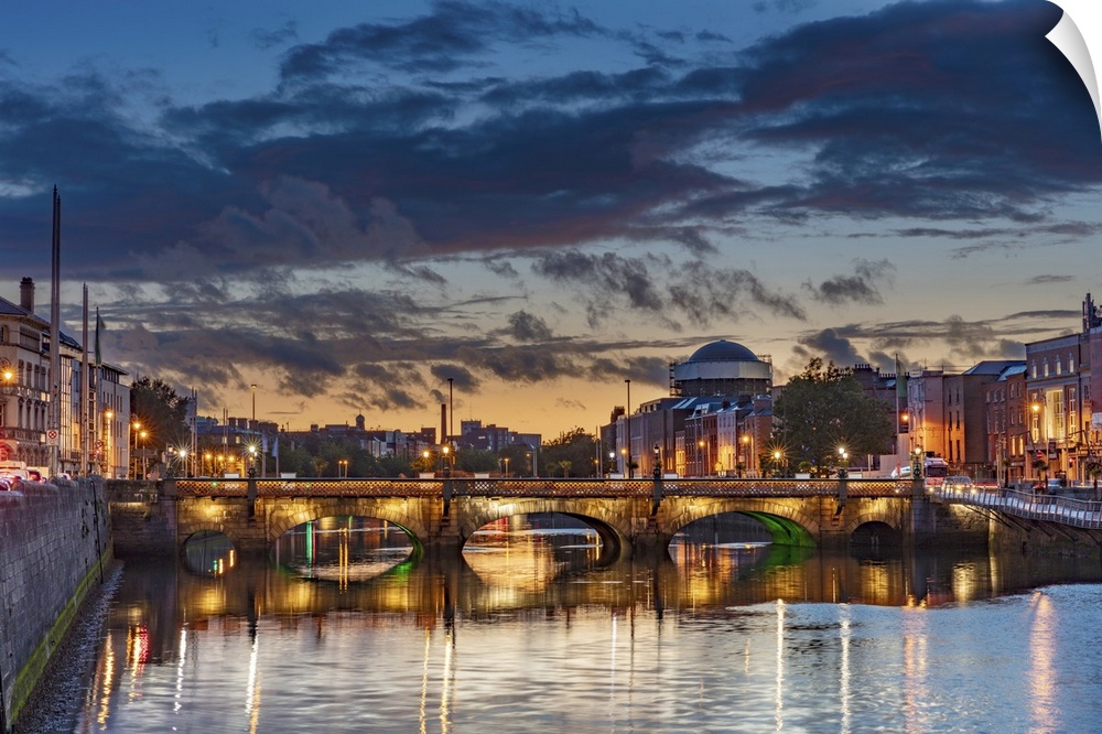 The Grattan bridge over the river Liffey at dusk in downtown Dublin, Ireland.