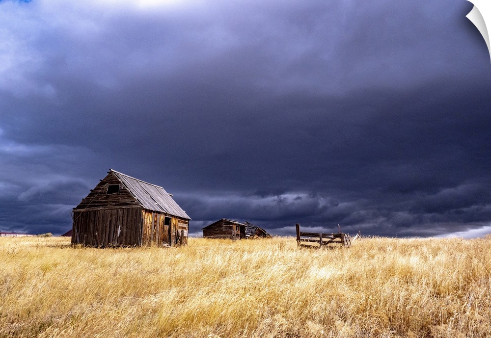 USA, Idaho, Highway 36, Liberty storm passing over old wooden barn. United States, Idaho.
