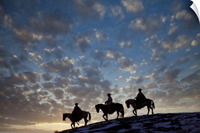 USA, Shell, Wyoming, Hideout Ranch, Cowboys And Cowgirls Silhouetted, Sunset