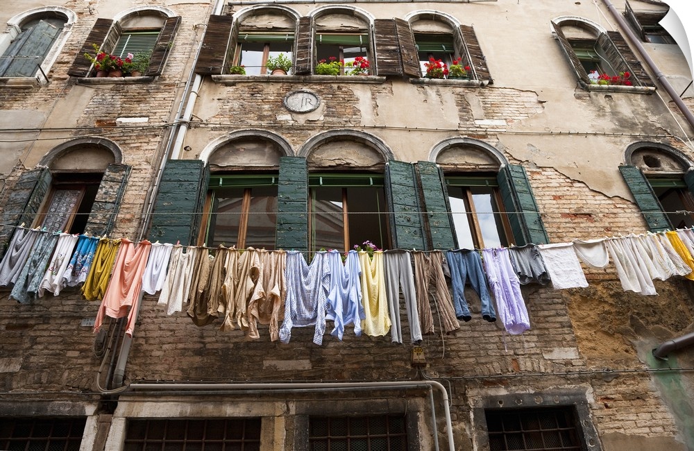 Venice, Veneto, Italy - Laundry is hanging on an outside clothesline to dry in an apartment neighborhood. Horizontal shot.