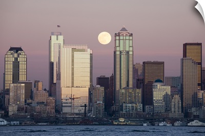 Washington, Seattle skyline and Elliott Bay with full moon rising, view from Alki