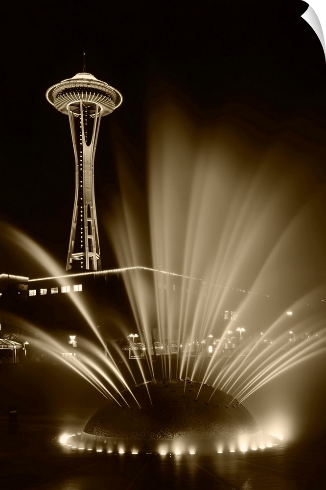 USA, Washington State, Seattle, Space Needle tower with fountain in foreground at night.