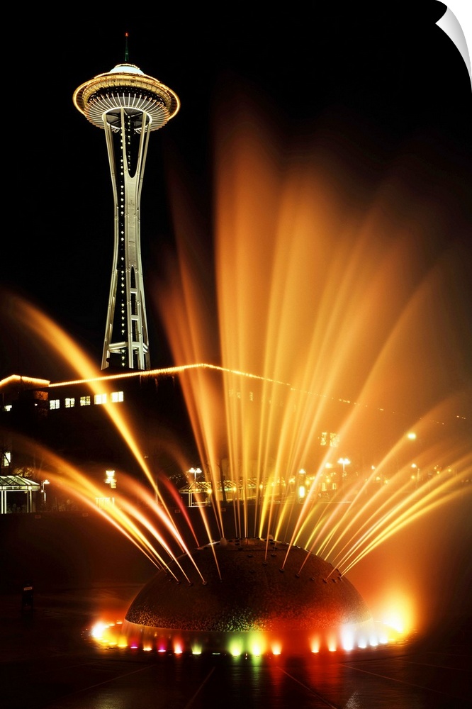 USA, Washington State, Seattle, Space Needle tower with fountain in foreground at night.