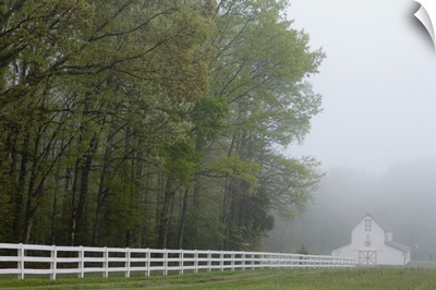 White farmhouse and fence in mist, Powhatan, Virginia, United States