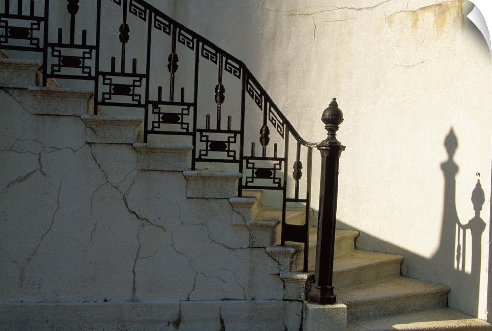 USA, Georgia, Savannah. Wrought iron railing and steps with shadow detail.