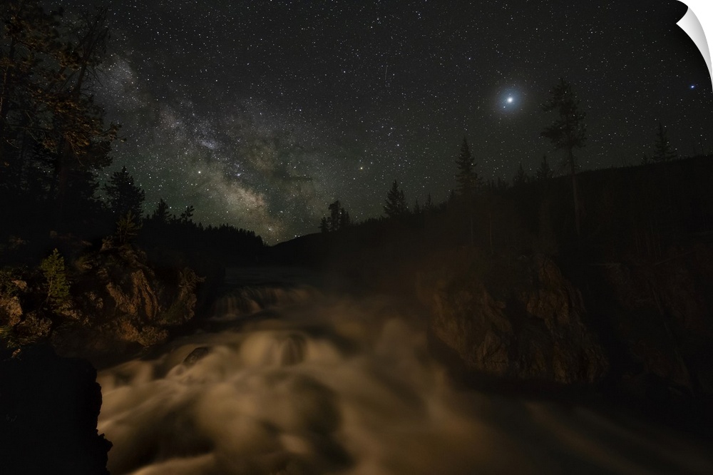 USA, Wyoming, Yellowstone National Park. Milky Way floats above a waterfall on the Firehole River in Yellowstone National ...