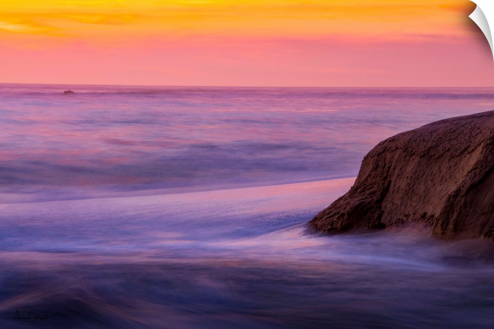 Rocks & Ocean Waves at sunset along the California Coast near Carmel, California, USA.