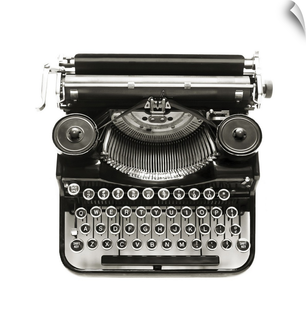 Antique typewriter against a crisp white backdrop.