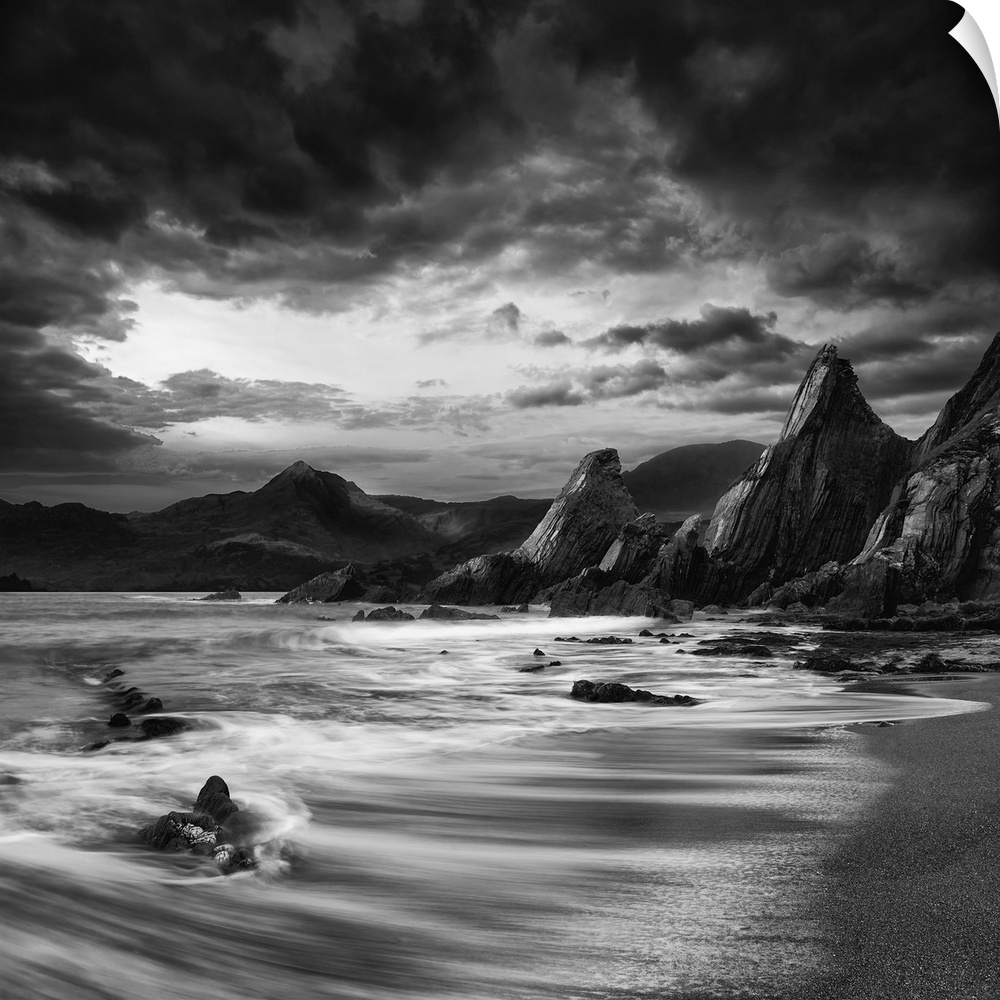 Stunning mountain and sea sunset landscape black and white.