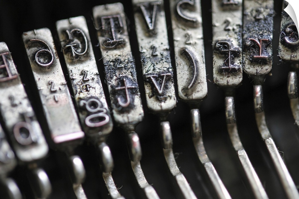 Detail of the gavel with inked letters of an old mechanical typewriter.
