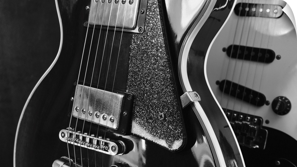 Electric guitar closeup on dark background.