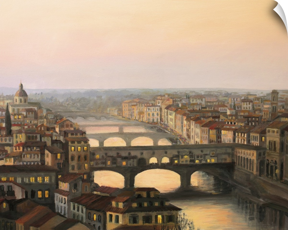 Sunset over Florence with Ponte Vecchio in the warm light.