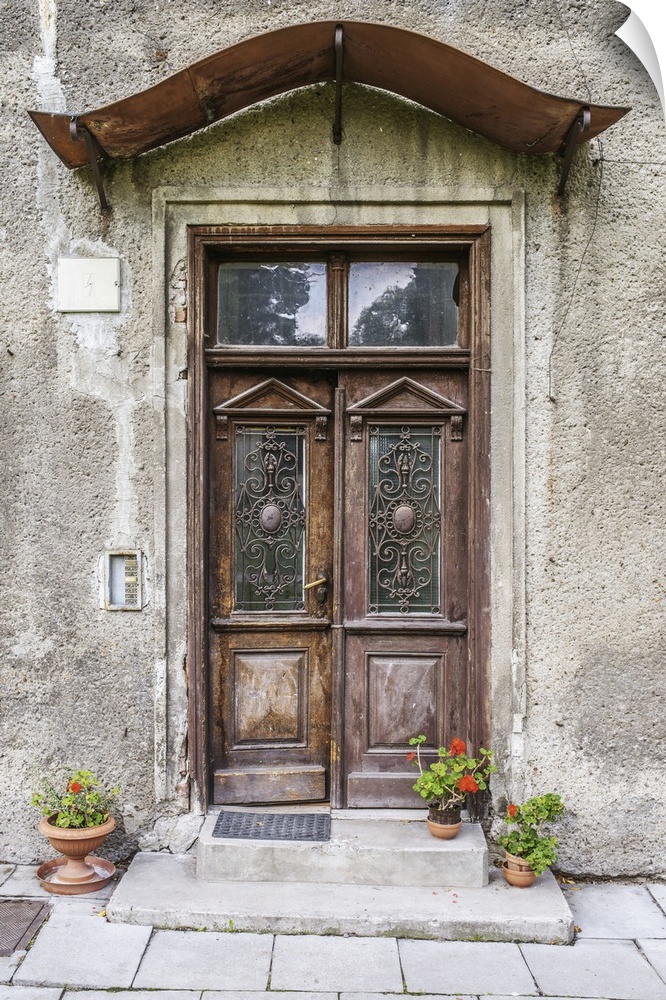 Old door in an ancient European stone house.
