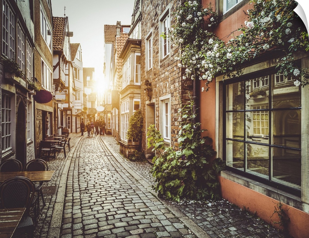 Old town in Europe at sunset with retro vintage Instagram style filter and lens flare effect.