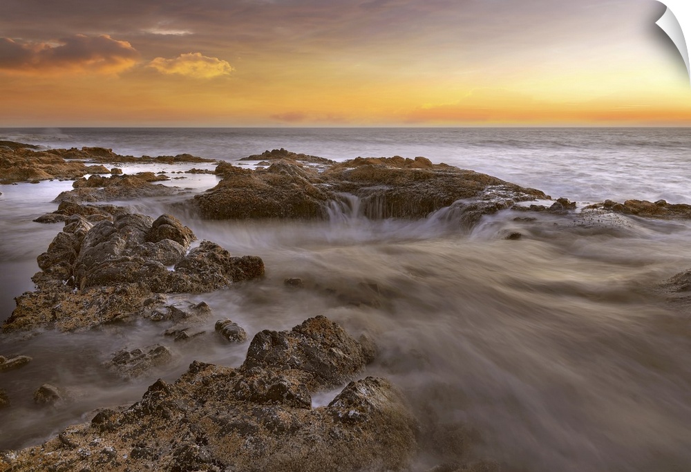 Thors well at Cooks chasm by Cape Perpetua on the Oregon coast during colorful sunset.