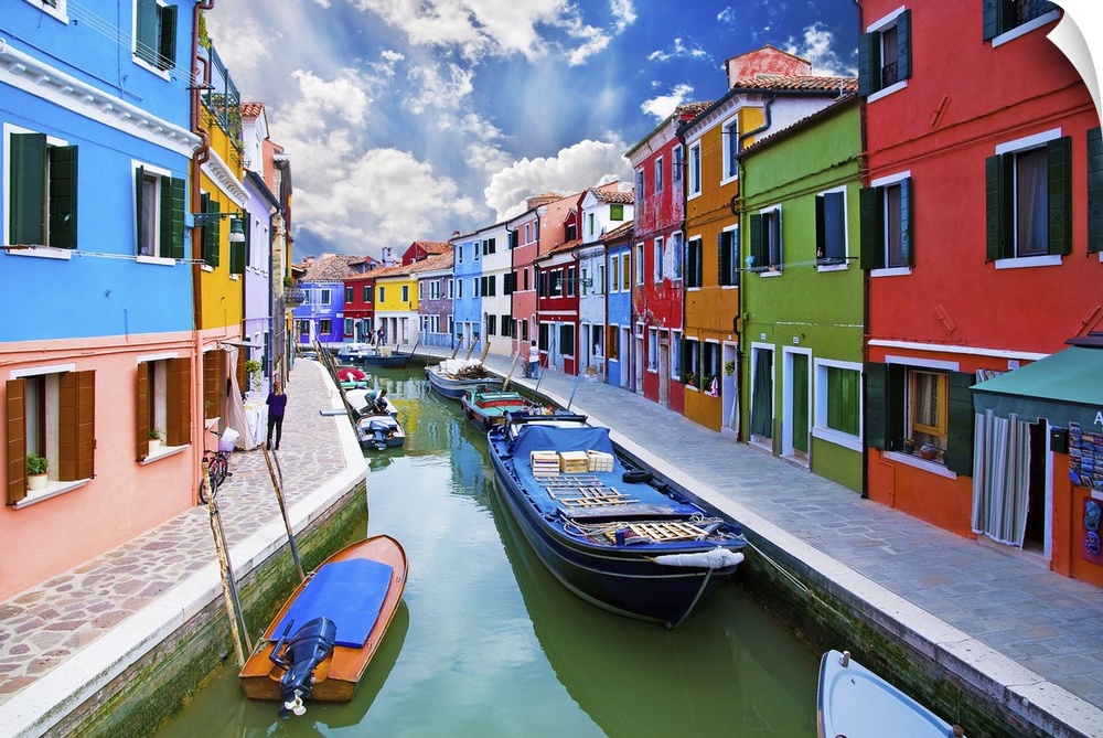 Venice, Burano Island Canal. Small colored houses and the boats.